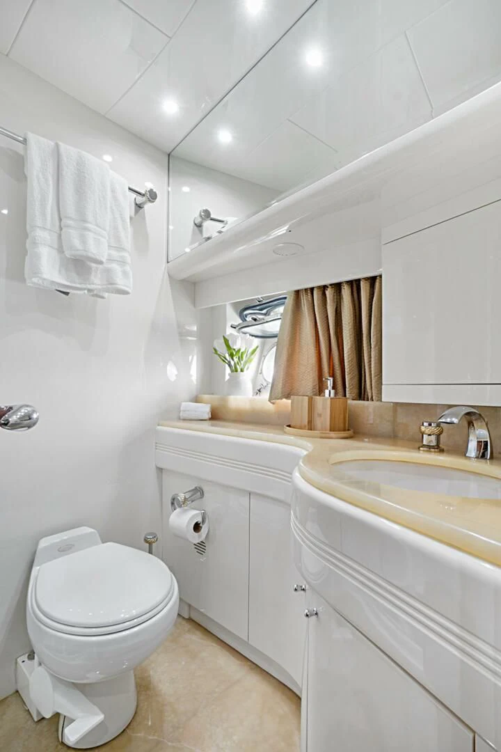 a bathroom with a toilet and sink aboard EL FARAON Yacht for Sale