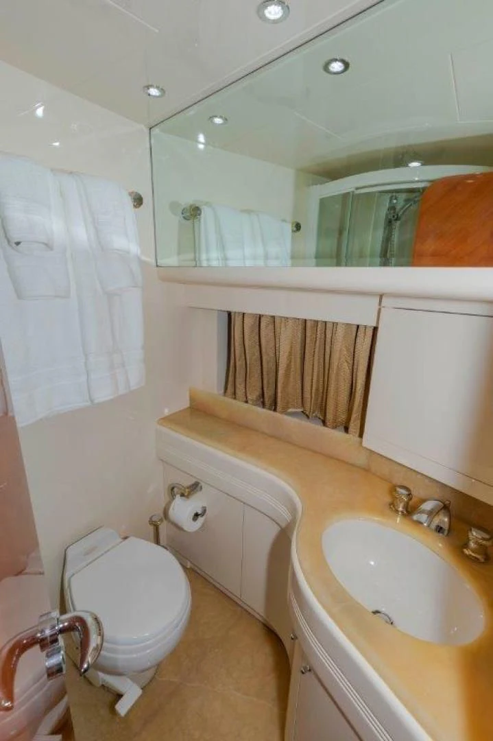 a bathroom with a toilet and sink aboard EL FARAON Yacht for Sale