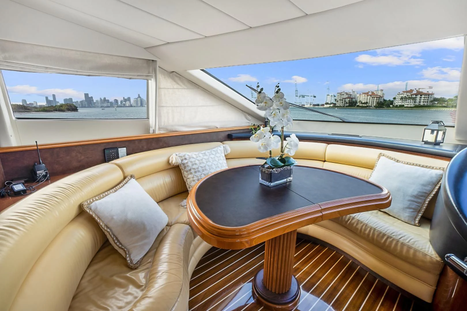 a living room with a table and couches aboard EL FARAON Yacht for Sale