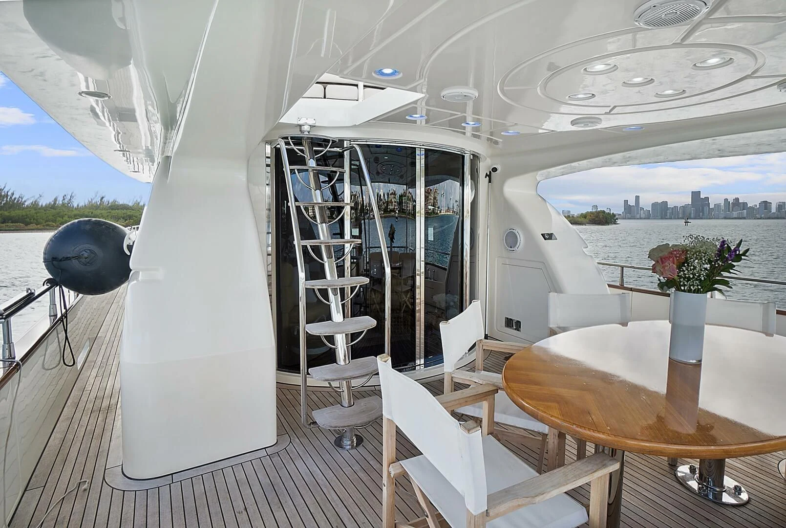 a room with a table and chairs aboard EL FARAON Yacht for Sale