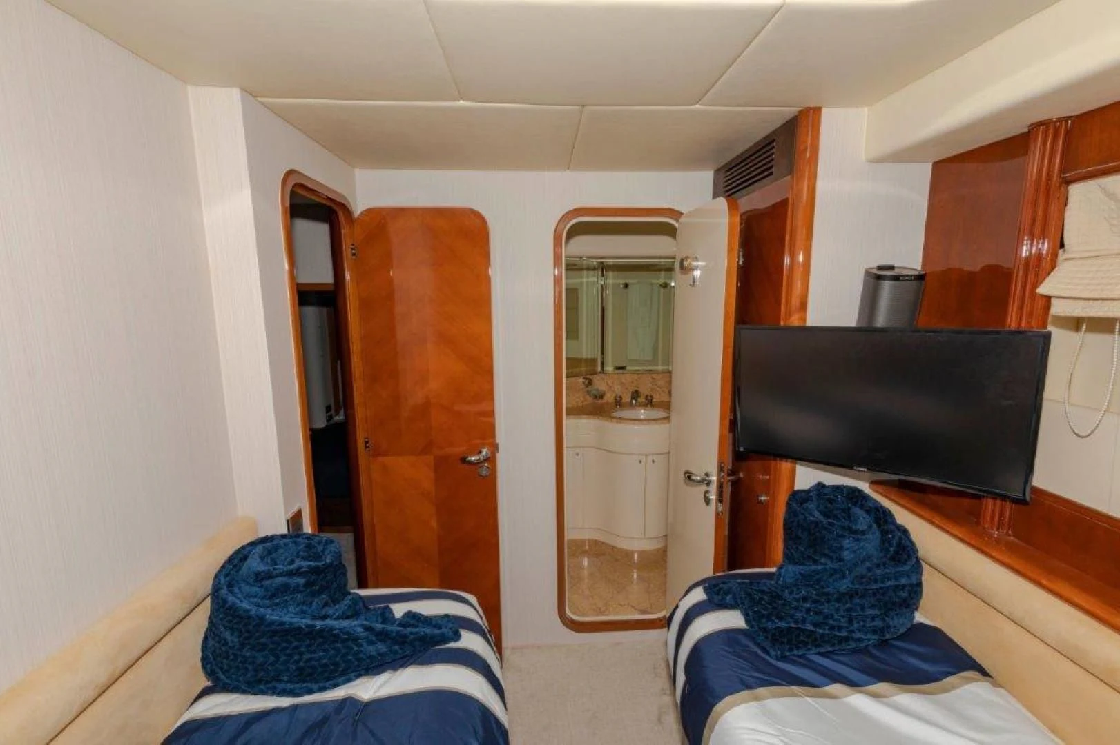 a room with a television and a bathtub aboard EL FARAON Yacht for Sale