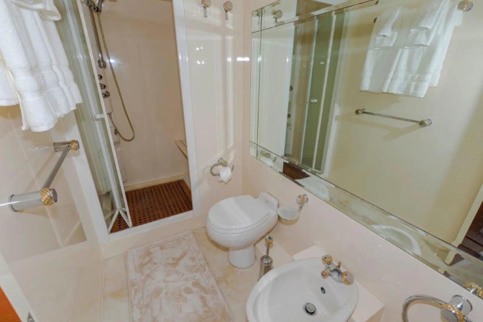 a bathroom with a sink toilet and shower aboard EL FARAON Yacht for Sale