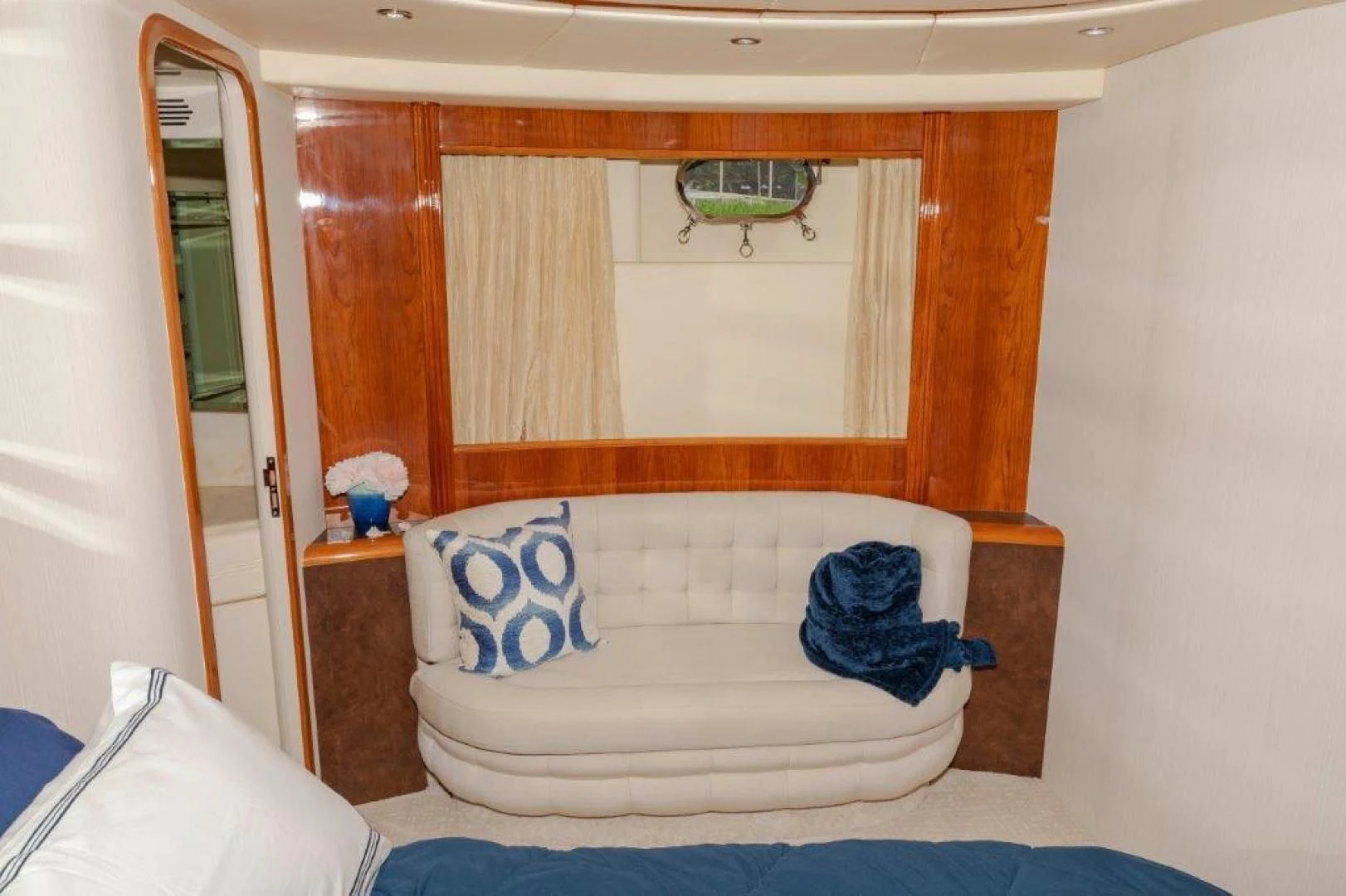 a room with a couch and a mirror aboard EL FARAON Yacht for Sale