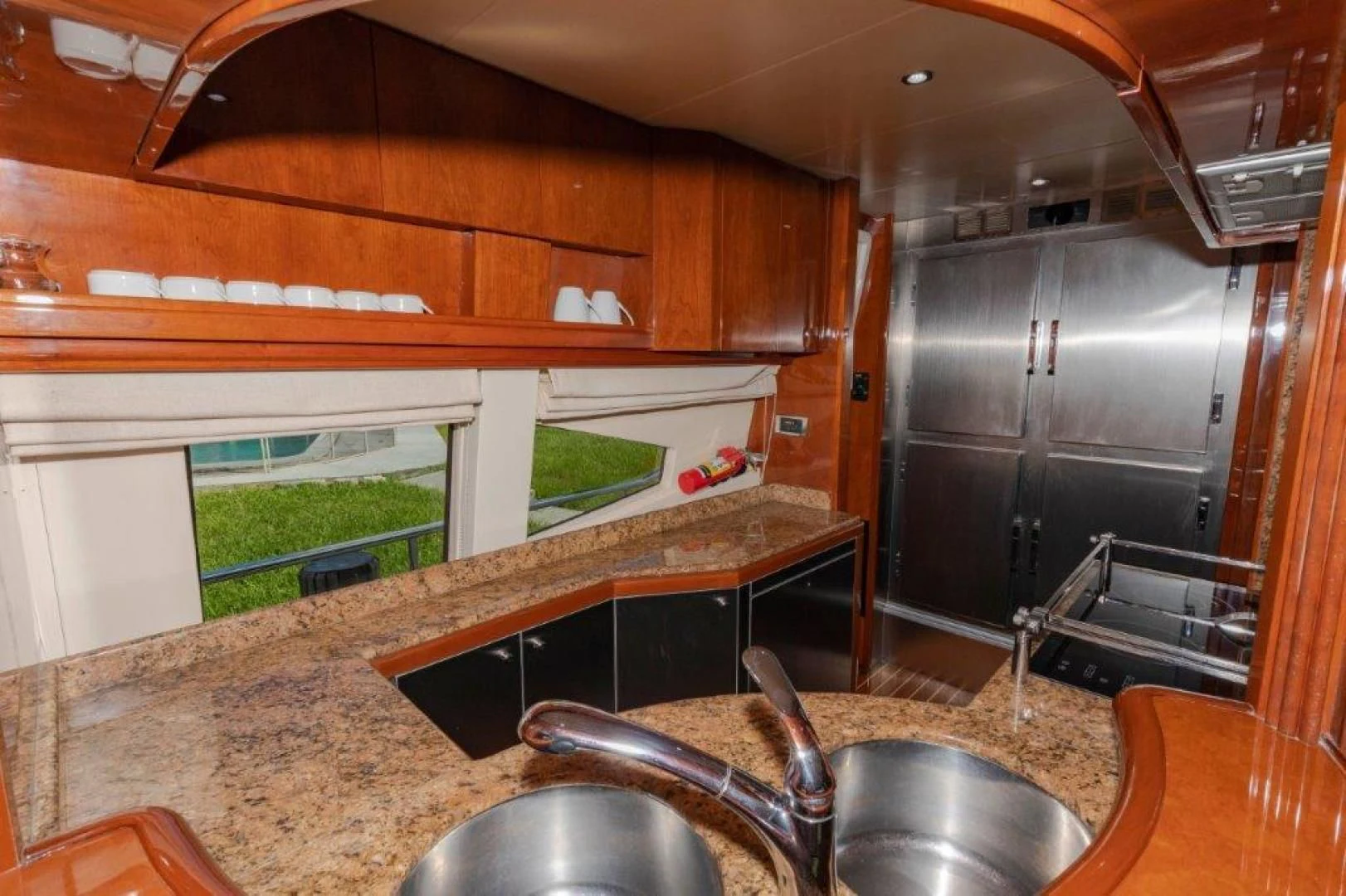 a kitchen with a sink and a large grill aboard EL FARAON Yacht for Sale