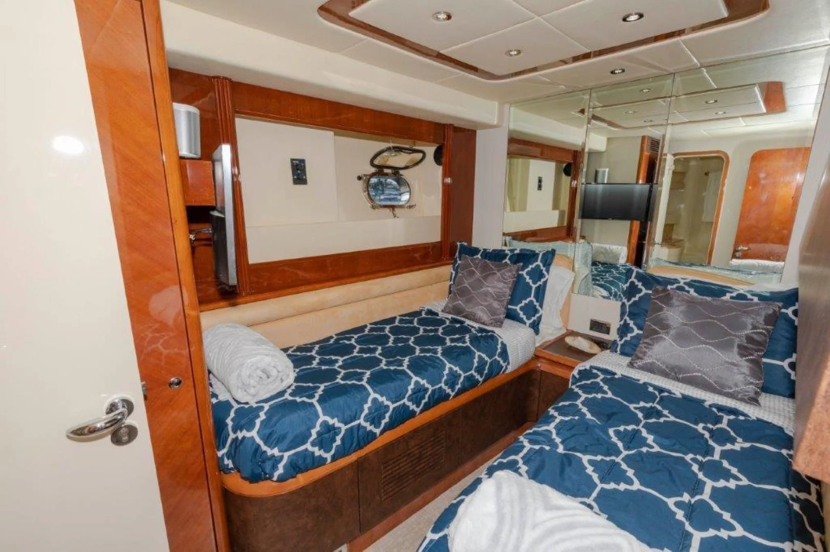 a bedroom with two beds aboard EL FARAON Yacht for Sale