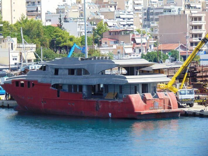 a tugboat in the harbor aboard THINGY Yacht for Sale
