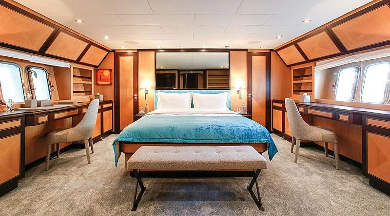 a bed in a room aboard THE OFFICE Yacht for Sale