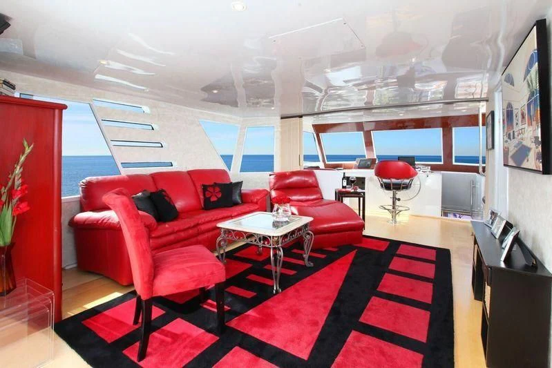 a room with red furniture aboard THE ADMIRAL Yacht for Sale