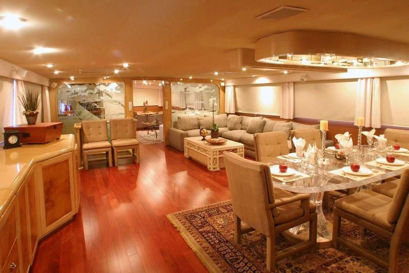 a living room with a dining table aboard THE ADMIRAL Yacht for Sale