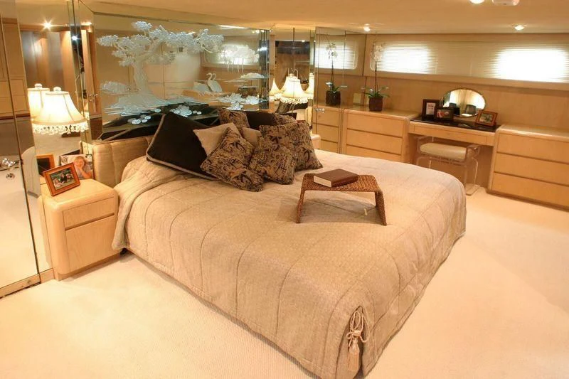 a large bed in a room aboard THE ADMIRAL Yacht for Sale