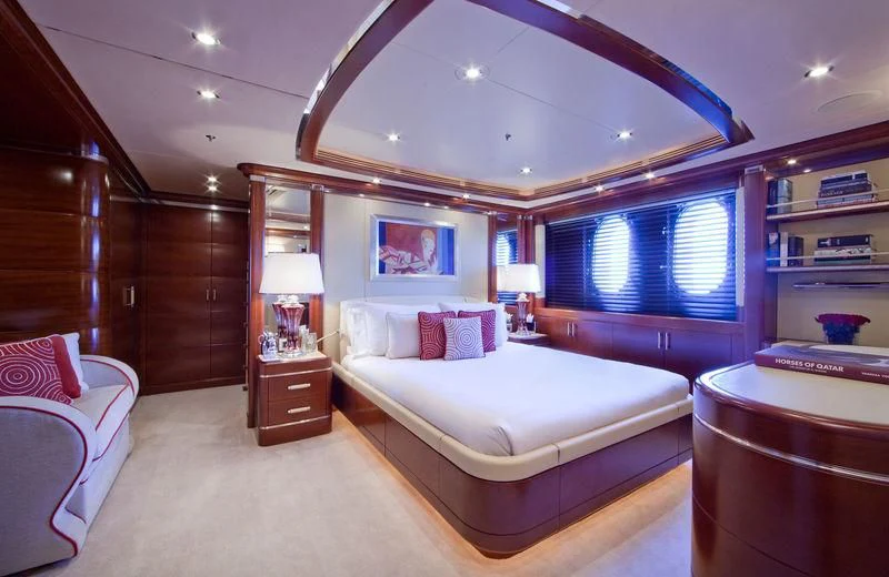 a bedroom with a large bed aboard LADY B Yacht for Charter