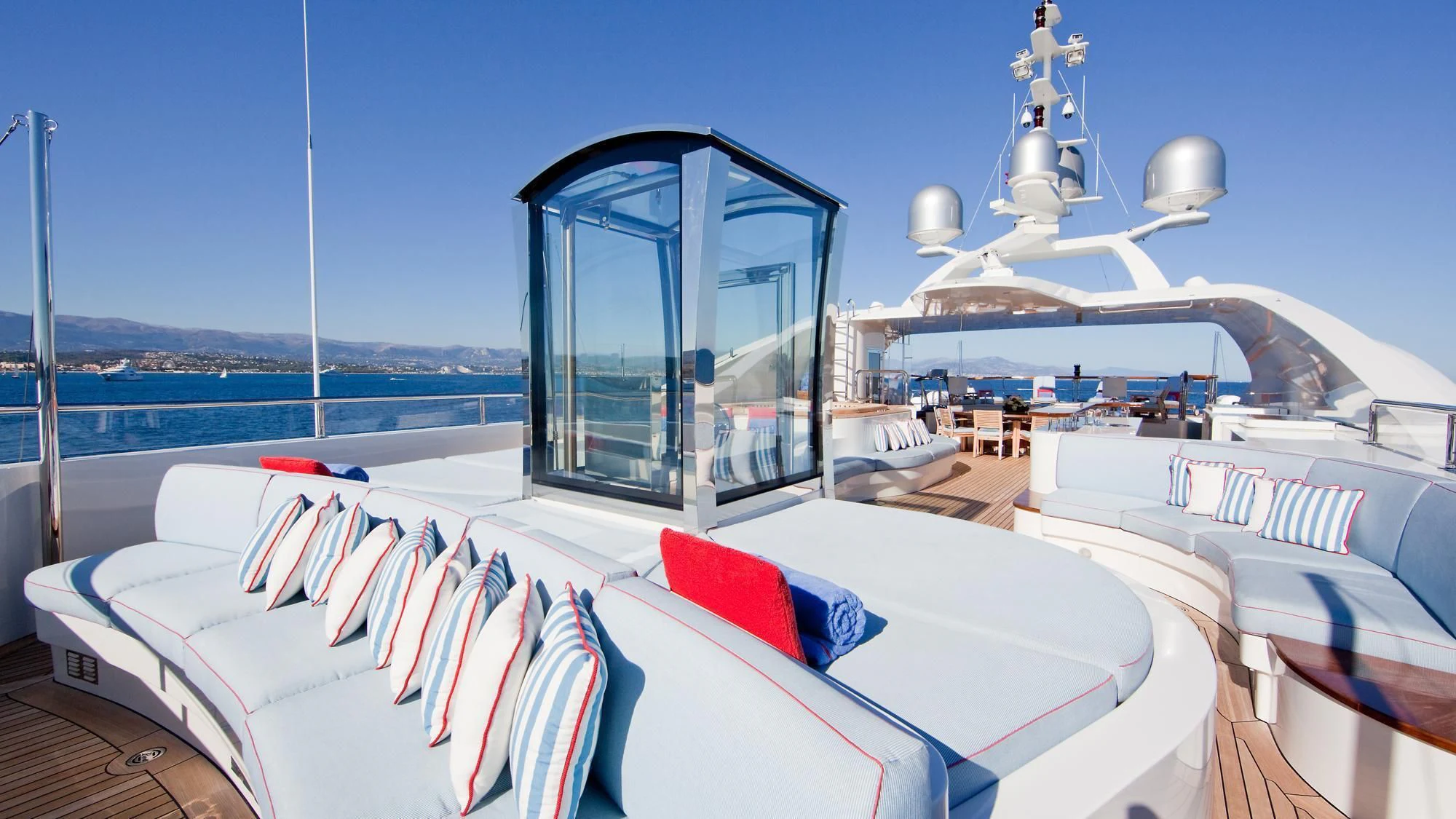 a large balcony overlooking a body of water aboard LADY B Yacht for Charter