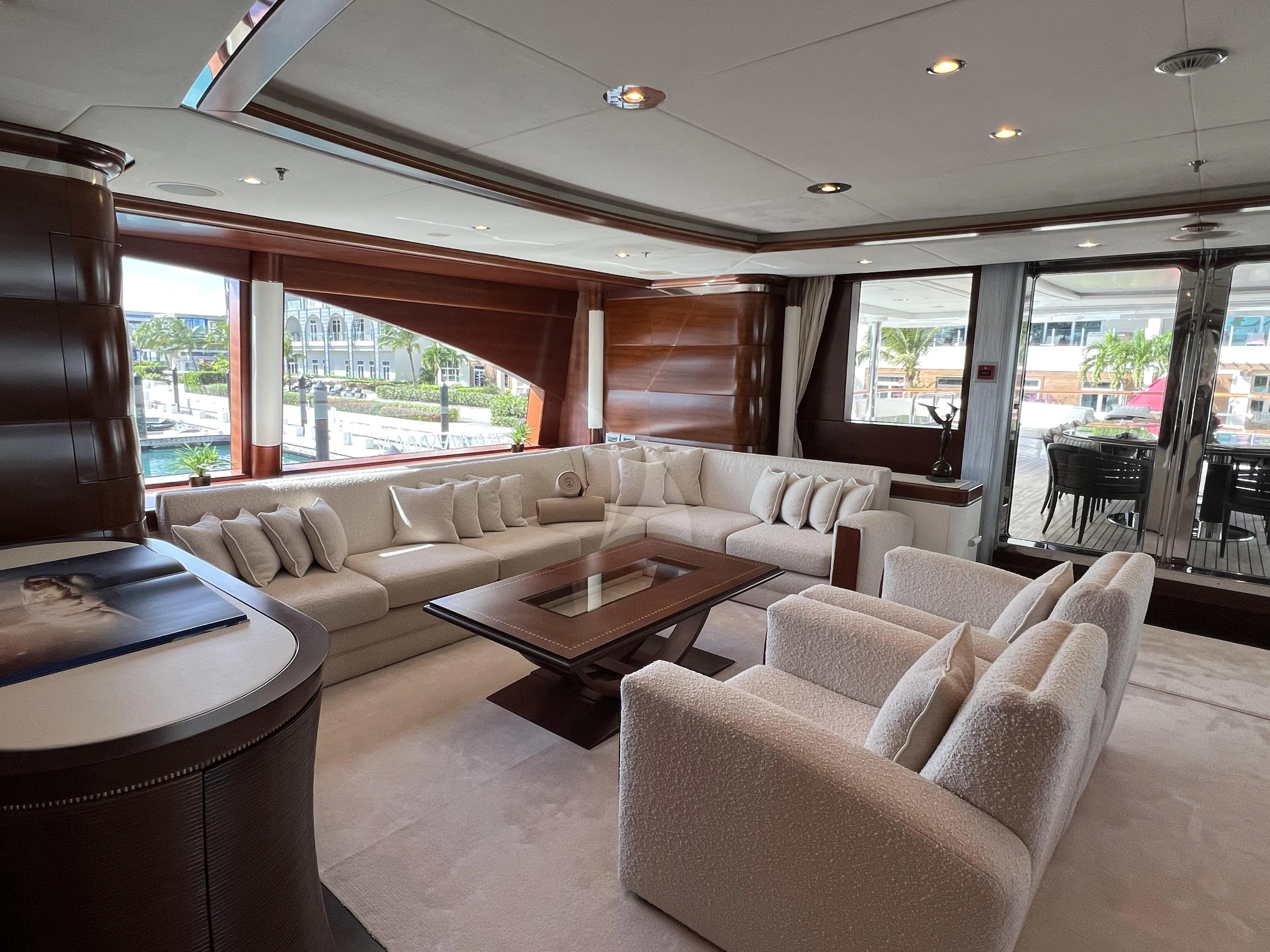 a living room with a large window aboard LADY B Yacht for Charter