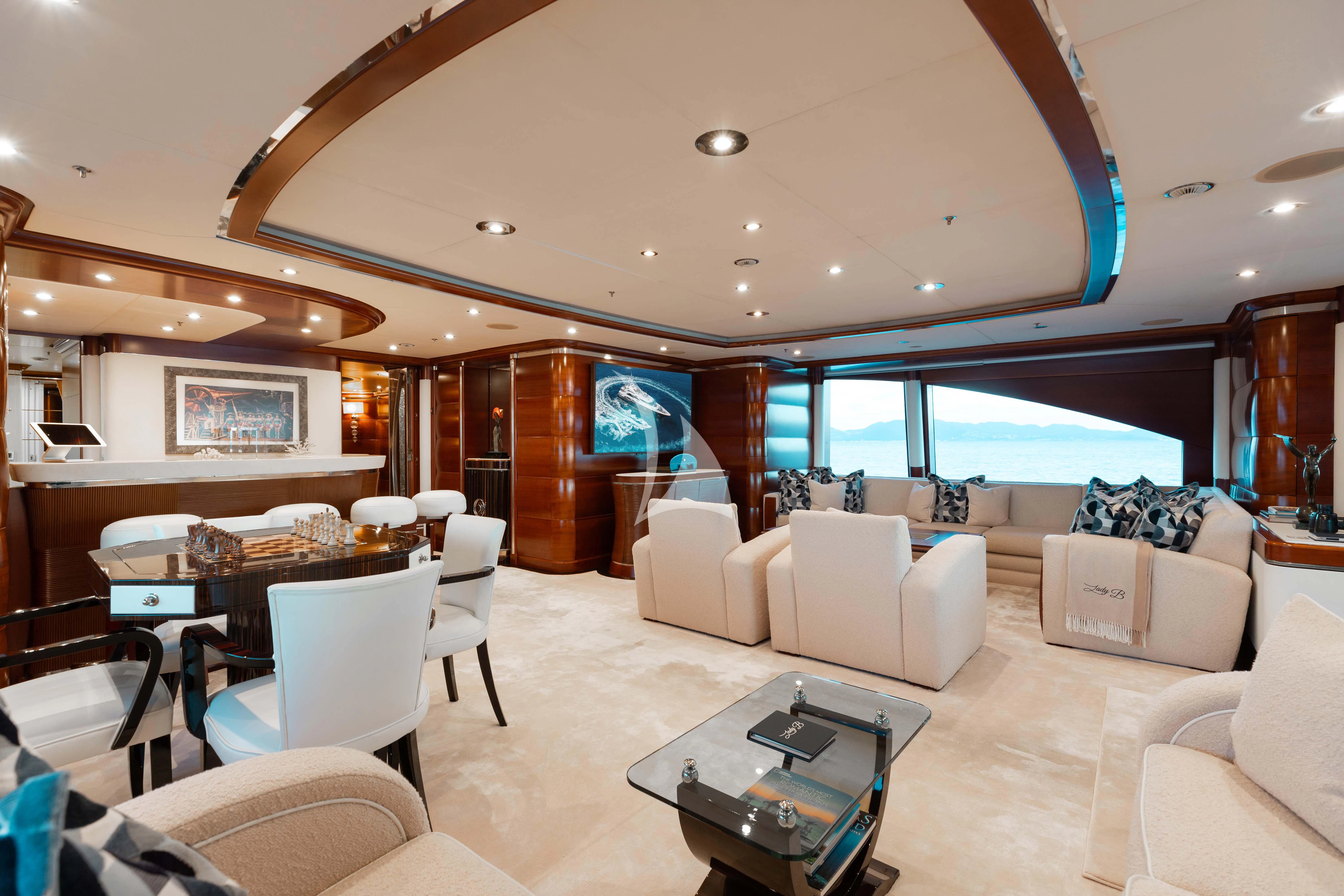 a living room with a large window aboard LADY B Yacht for Charter
