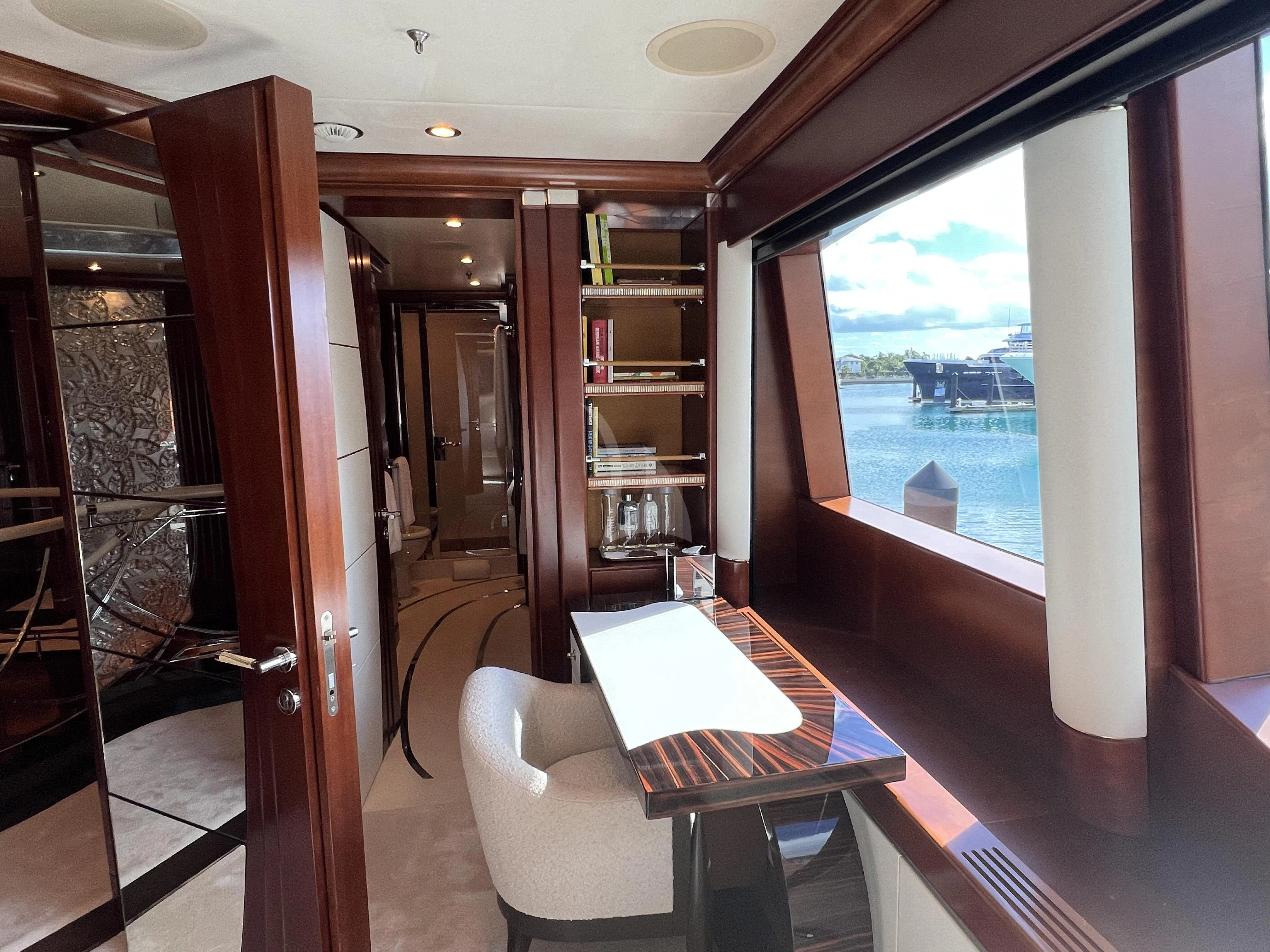 a room with a table and a couch aboard LADY B Yacht for Charter