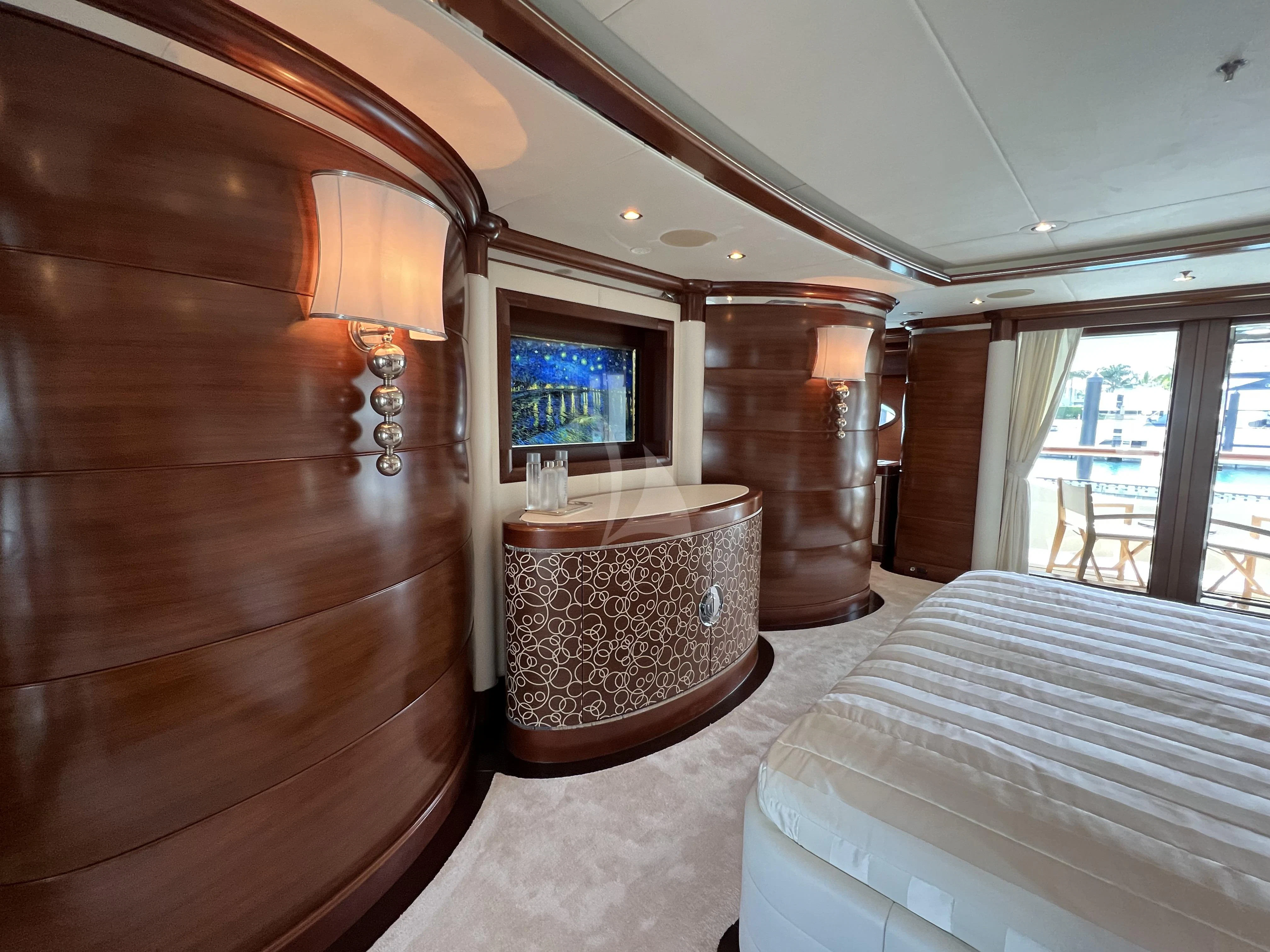 a room with a chair and a table aboard LADY B Yacht for Charter