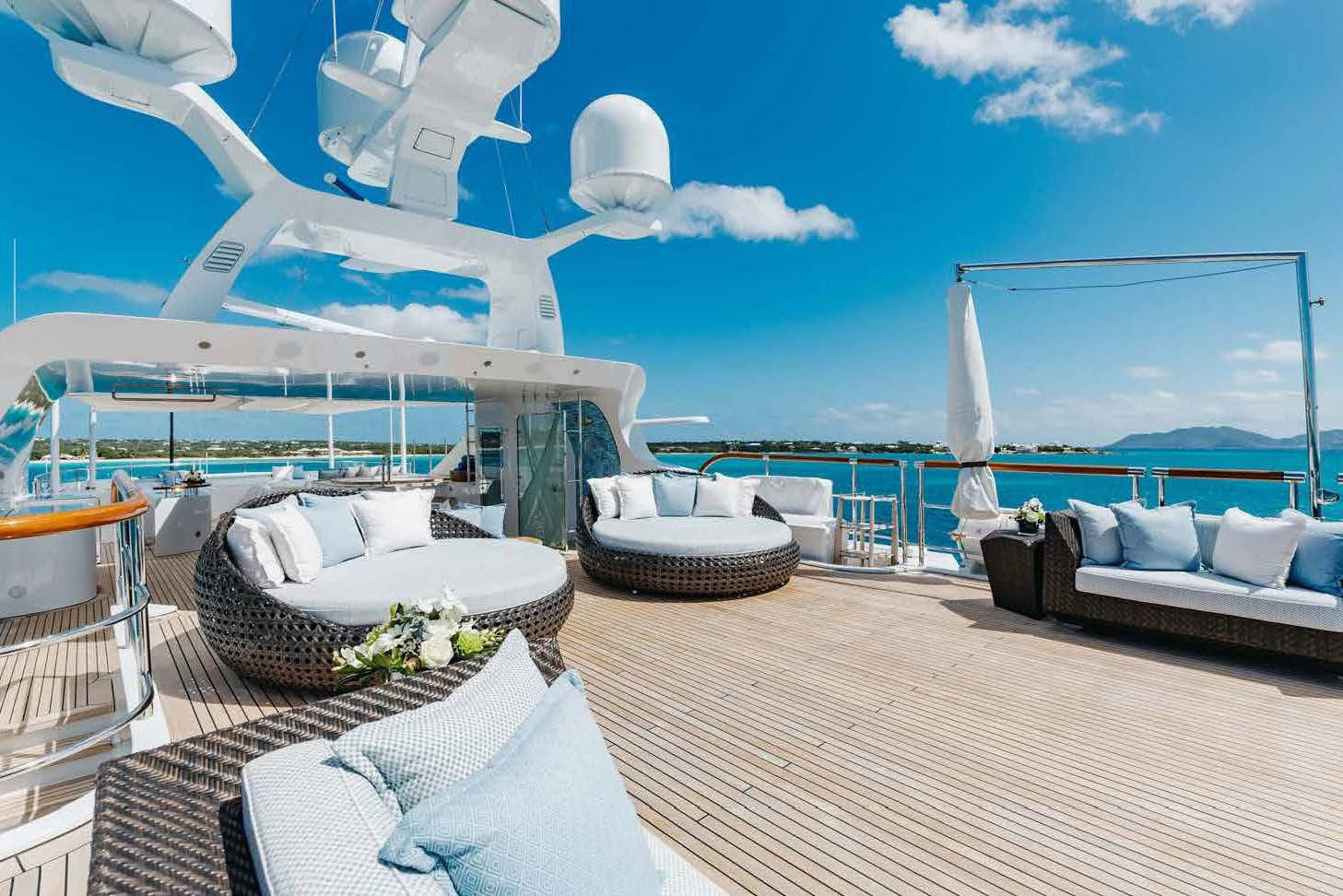 a balcony with a view of the ocean and the ocean aboard LADY B Yacht for Charter
