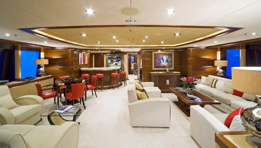 a room with a couch and a table and chairs aboard LADY B Yacht for Charter