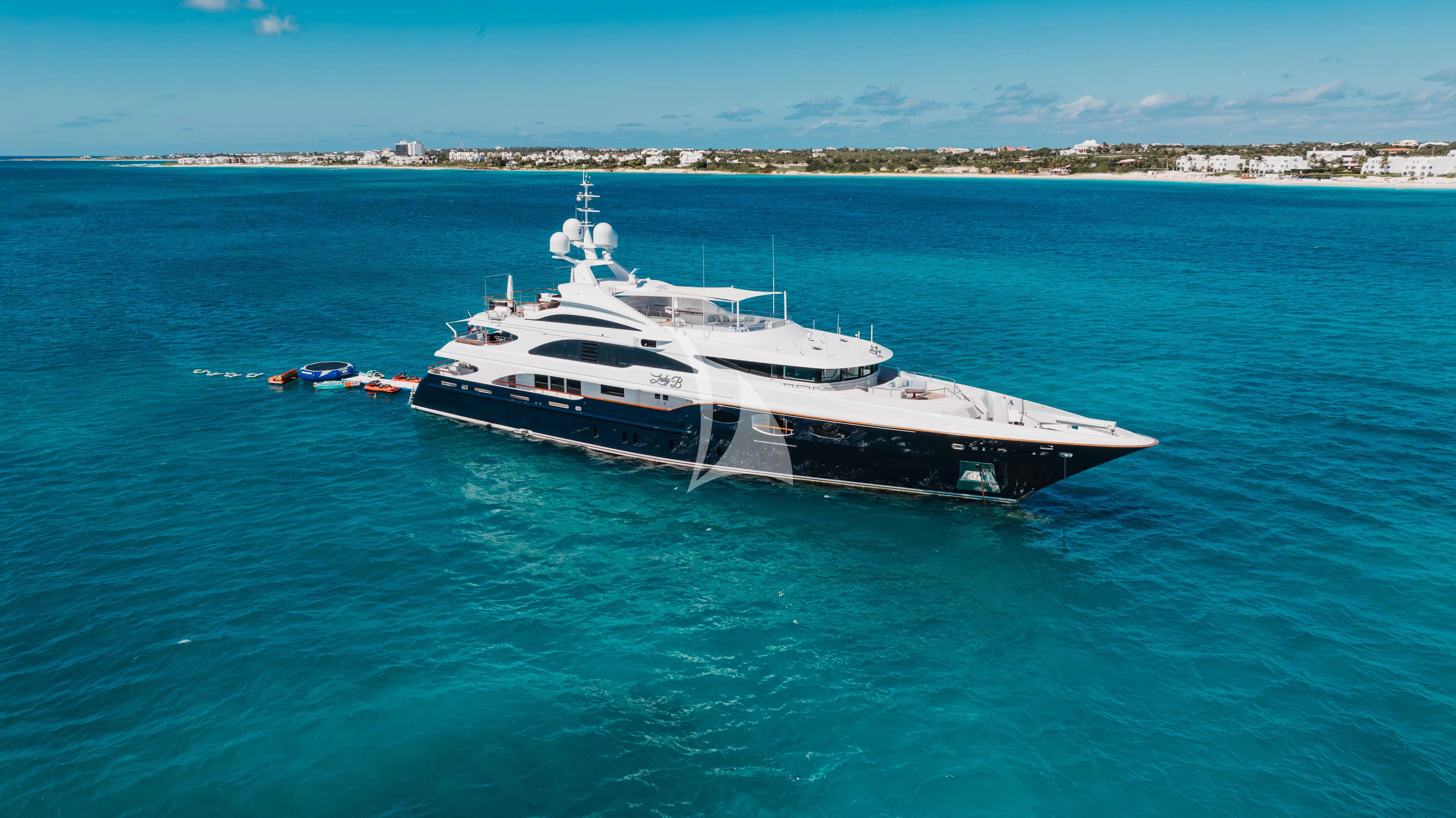a large white boat in the water aboard LADY B Yacht for Charter
