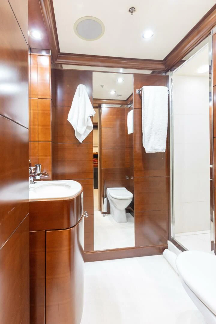 a bathroom with a glass shower aboard LADY B Yacht for Charter