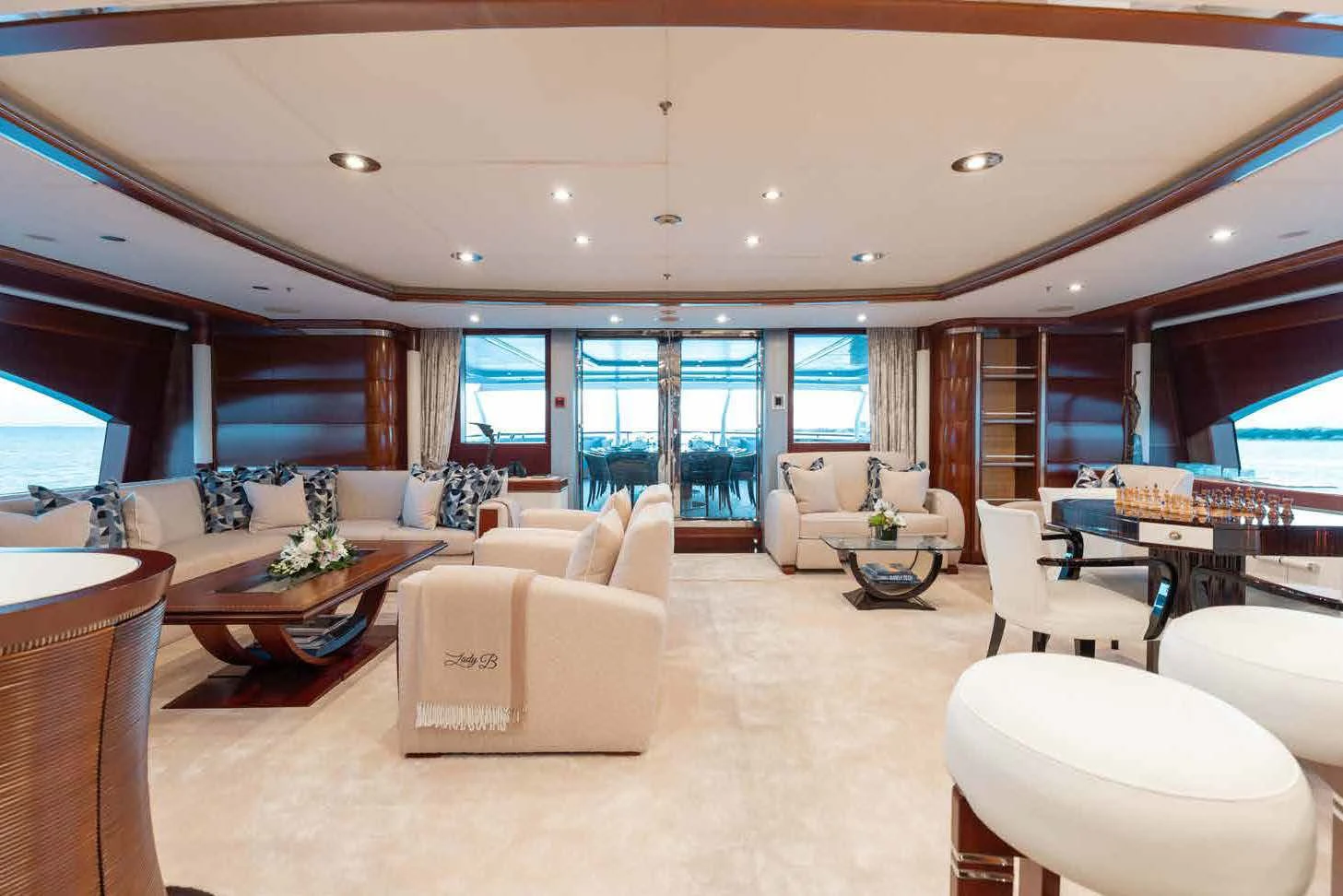 a living room with a large window aboard LADY B Yacht for Charter