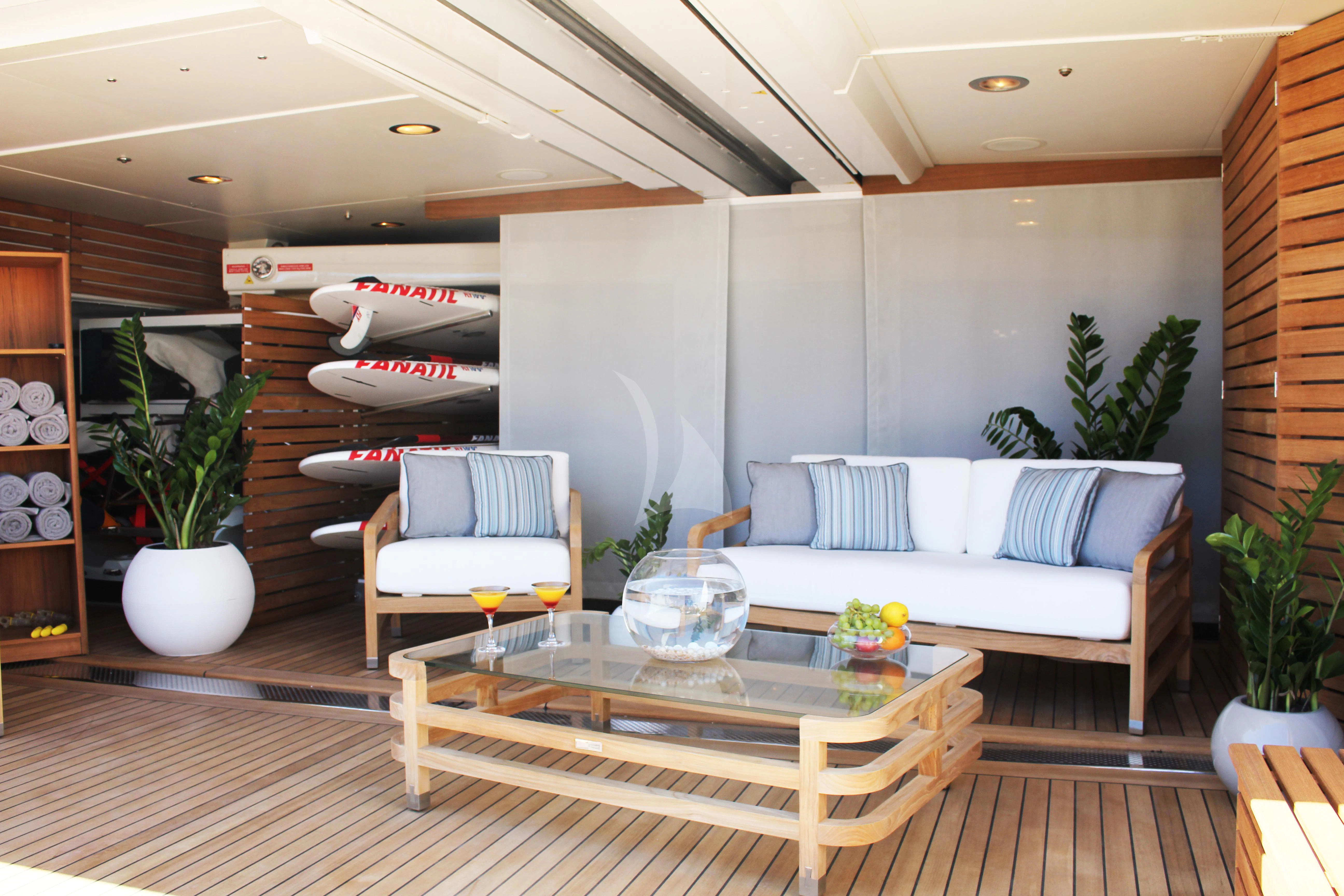 a living room with a couch and a table aboard LADY B Yacht for Charter