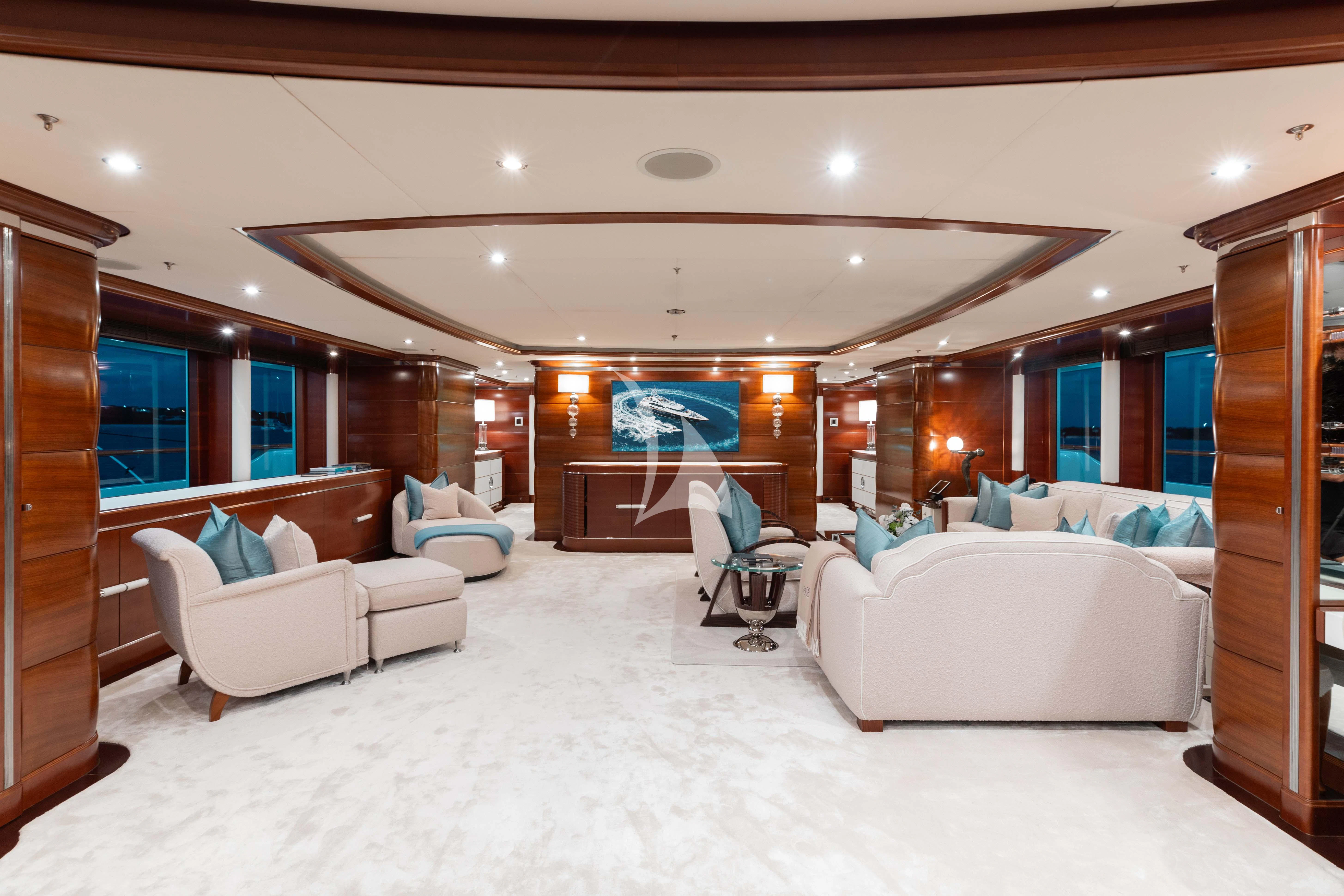 a room with a bed and a chair aboard LADY B Yacht for Charter