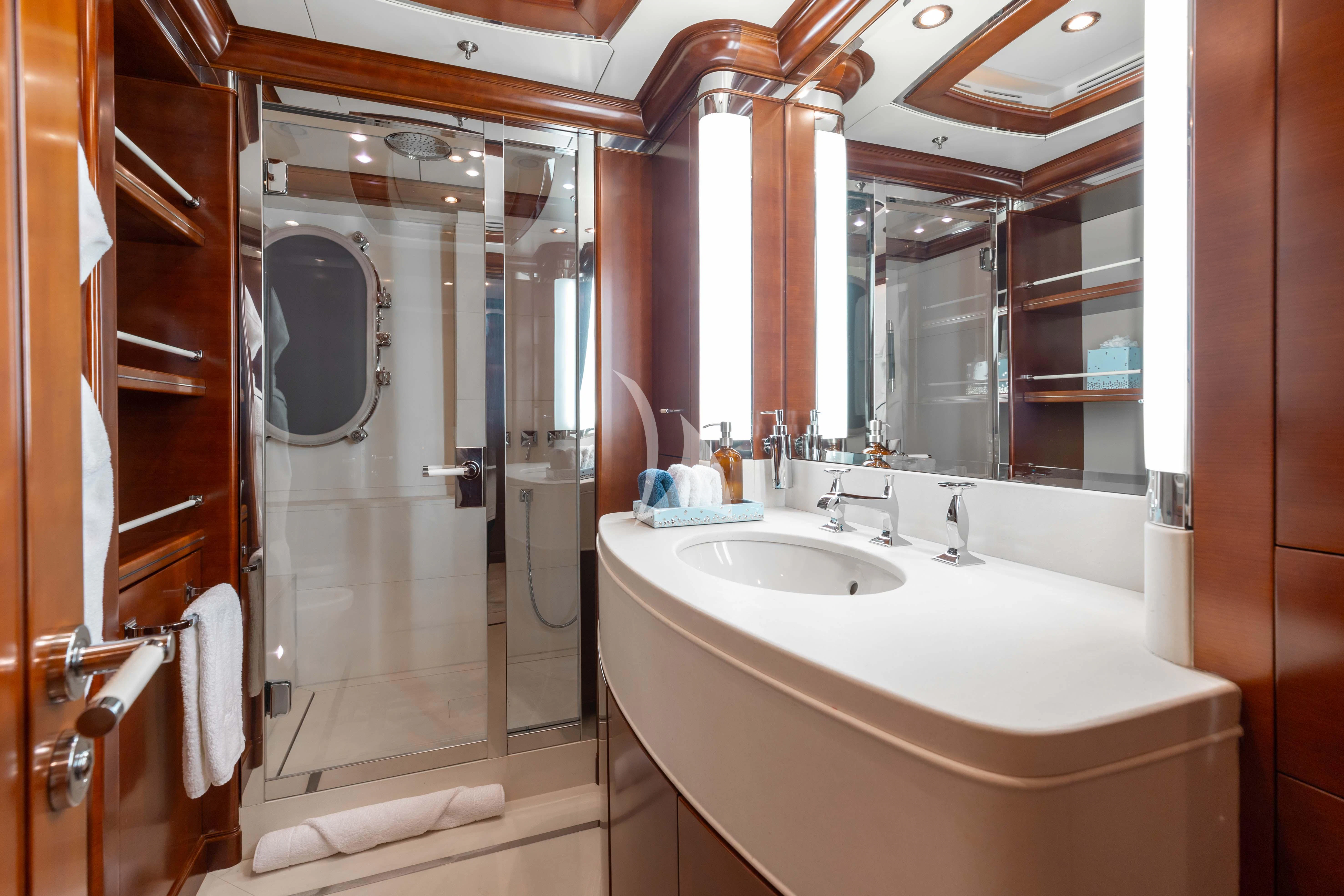 a bathroom with a large mirror aboard LADY B Yacht for Charter