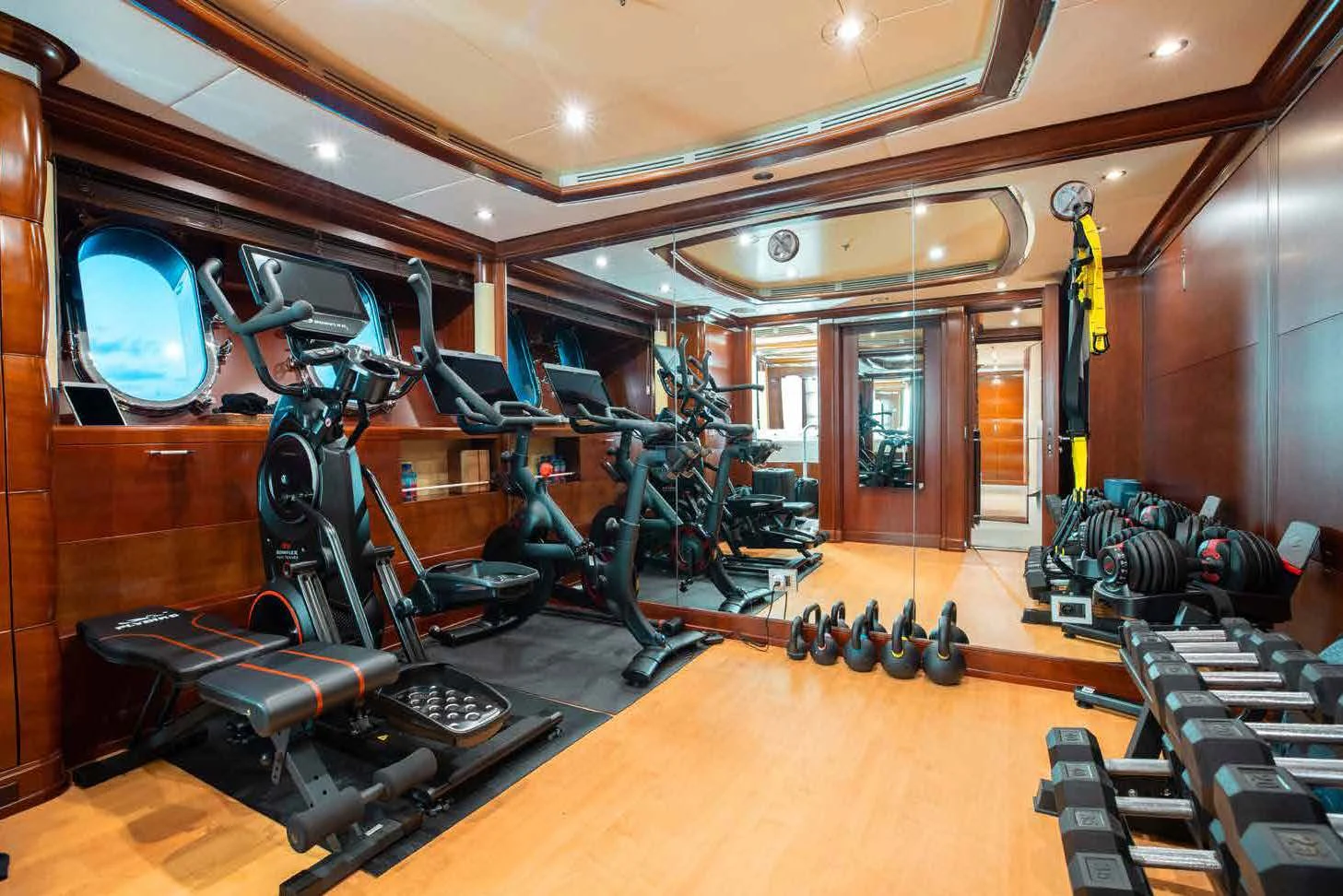 a gym with exercise equipment aboard LADY B Yacht for Charter