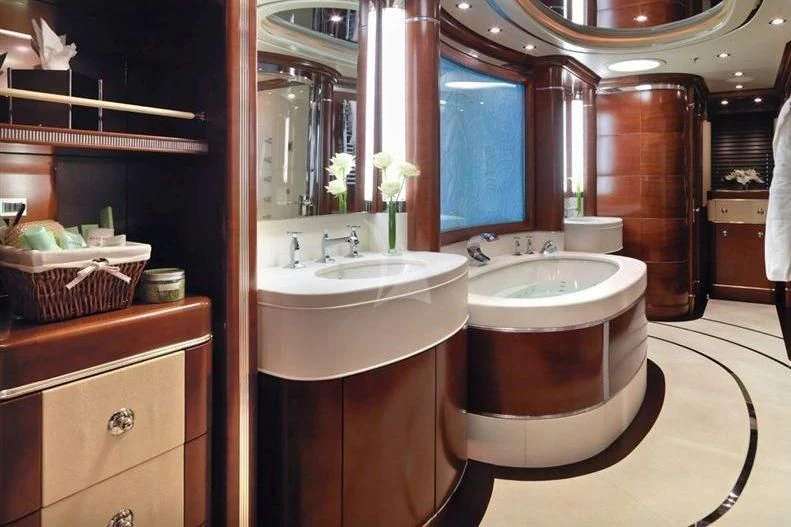 a bathroom with a sink and a mirror aboard LADY B Yacht for Charter