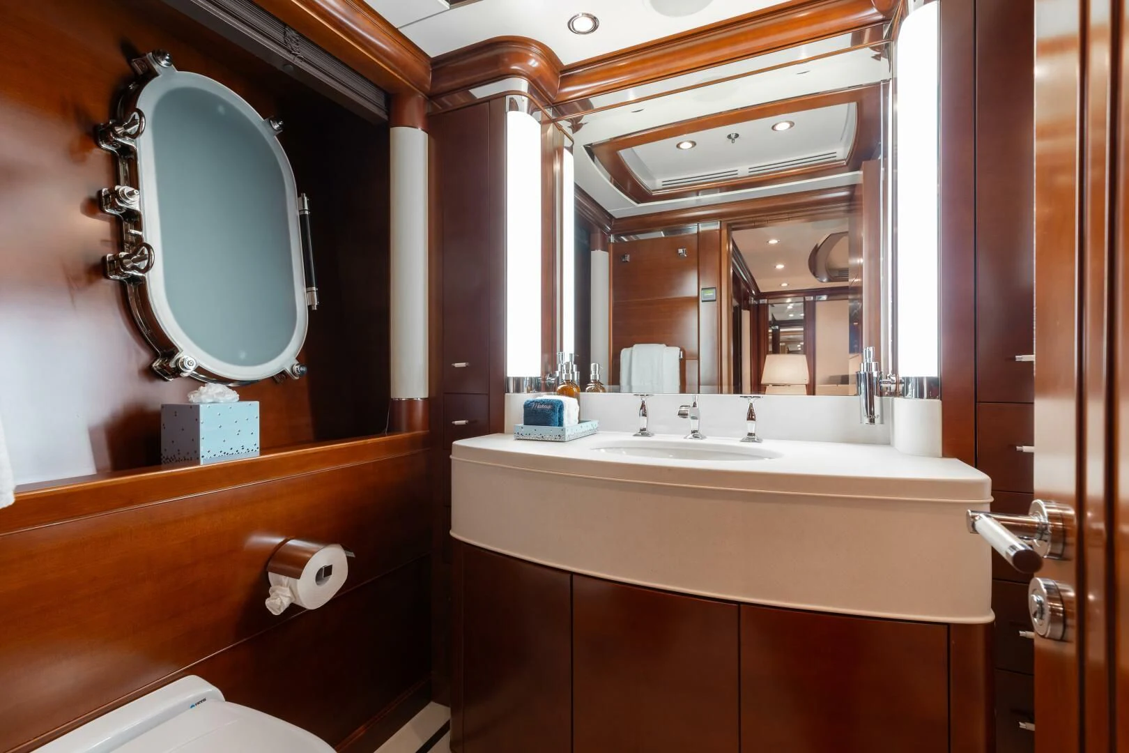 a bathroom with a large mirror aboard LADY B Yacht for Charter