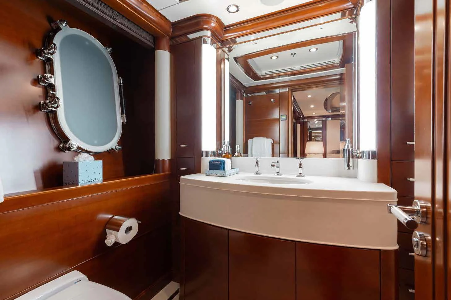 a bathroom with a large mirror aboard LADY B Yacht for Charter