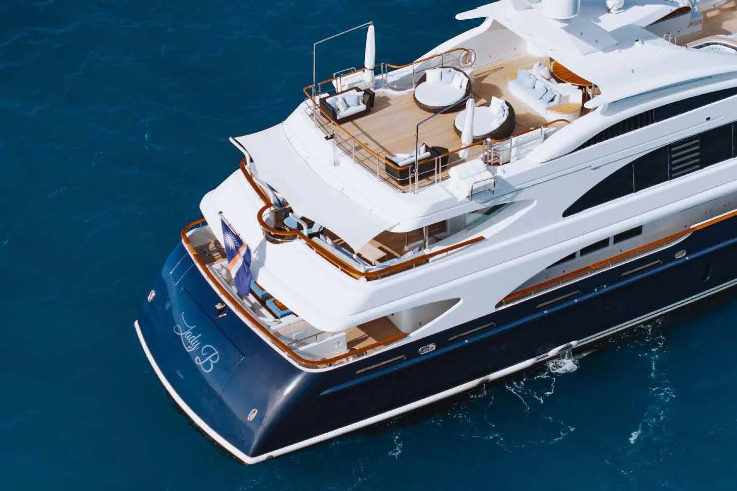 a large white boat in the water aboard LADY B Yacht for Charter