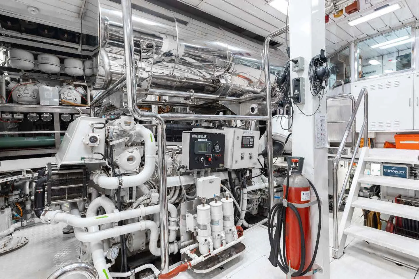 a large white machine in a room aboard LADY B Yacht for Charter