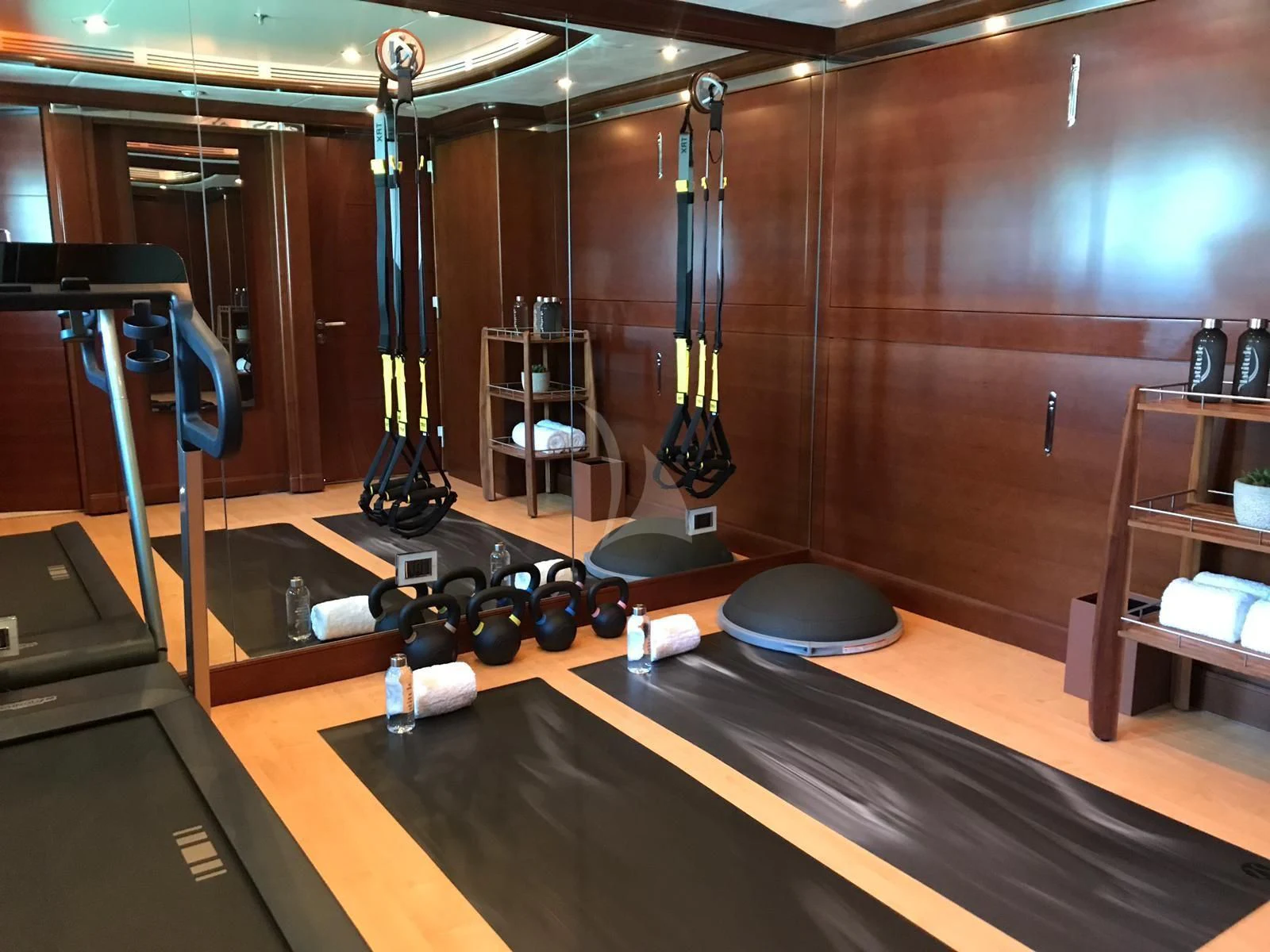 a gym with equipment and equipment aboard LADY B Yacht for Charter