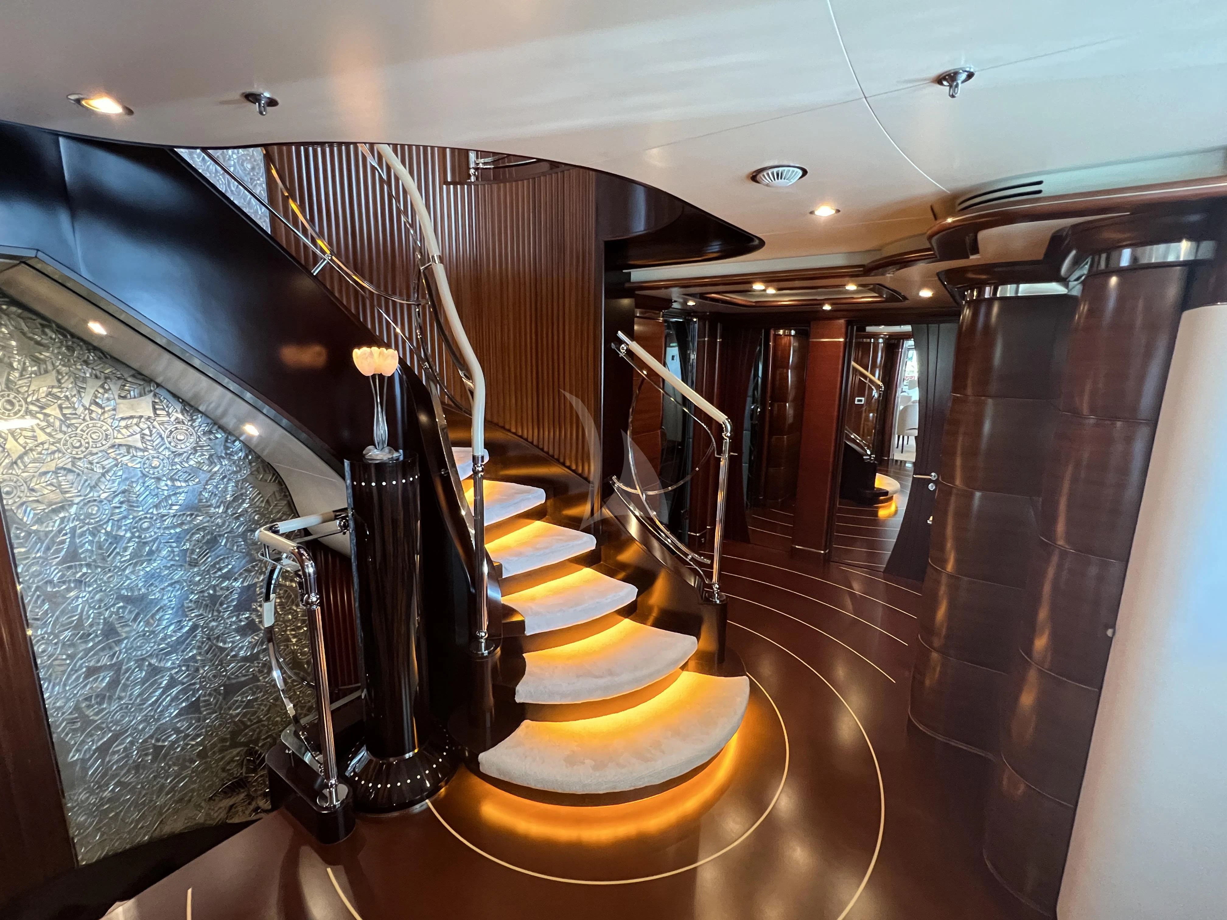 a large room with stairs aboard LADY B Yacht for Charter