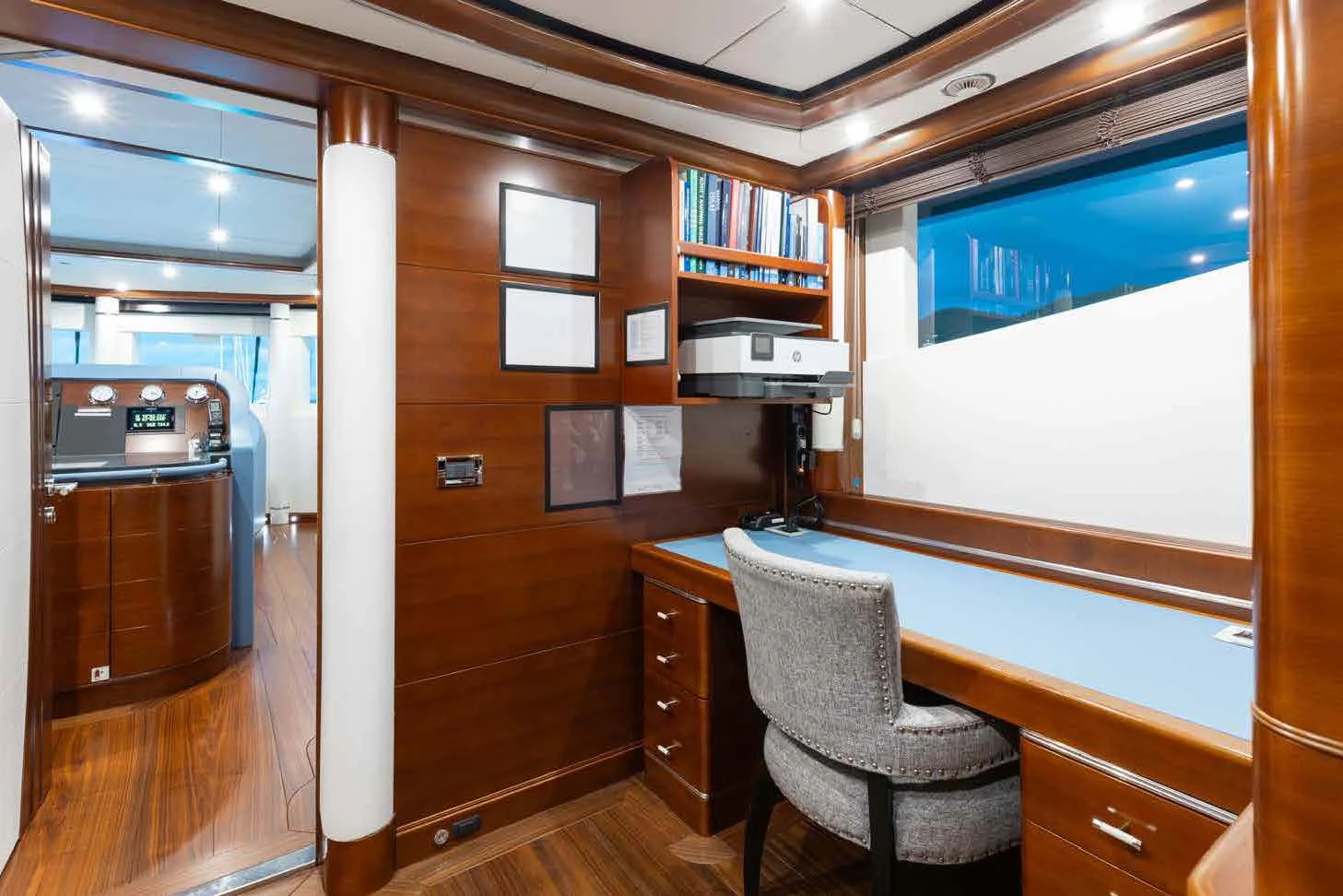 a room with a desk and a chair aboard LADY B Yacht for Charter
