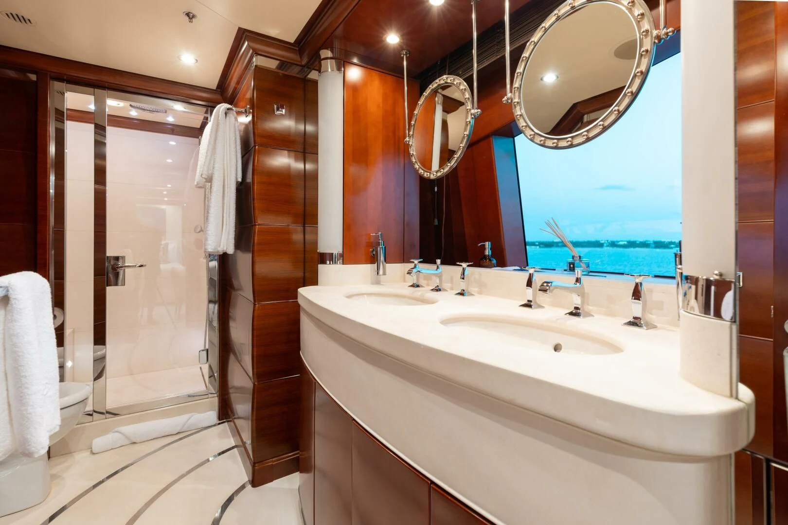 a bathroom with a large mirror aboard LADY B Yacht for Charter