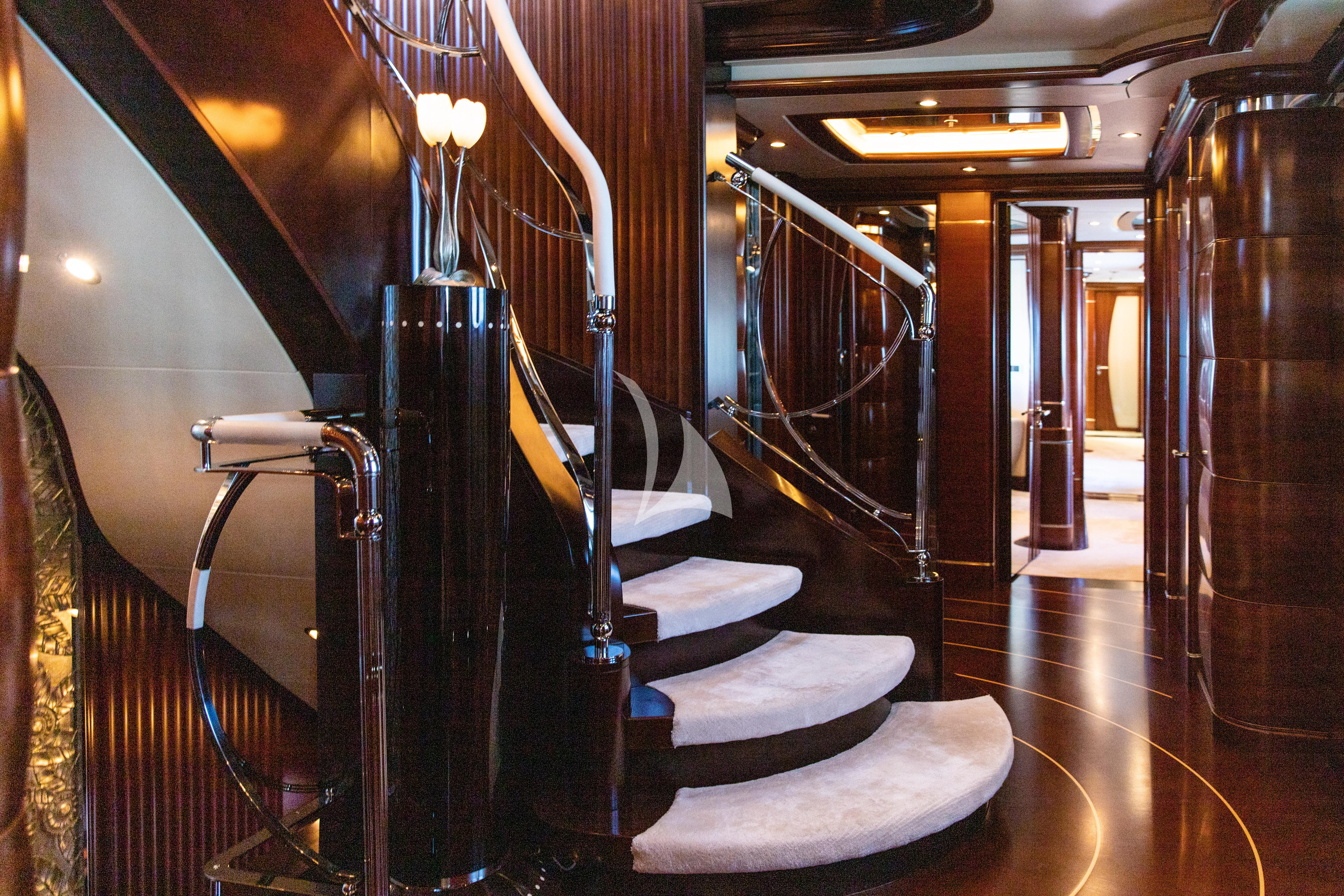 a room with a large staircase aboard LADY B Yacht for Charter