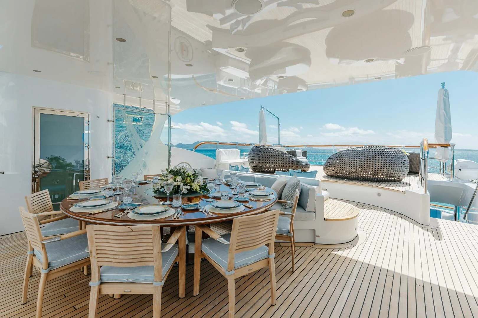 a large room with a table and chairs aboard LADY B Yacht for Charter