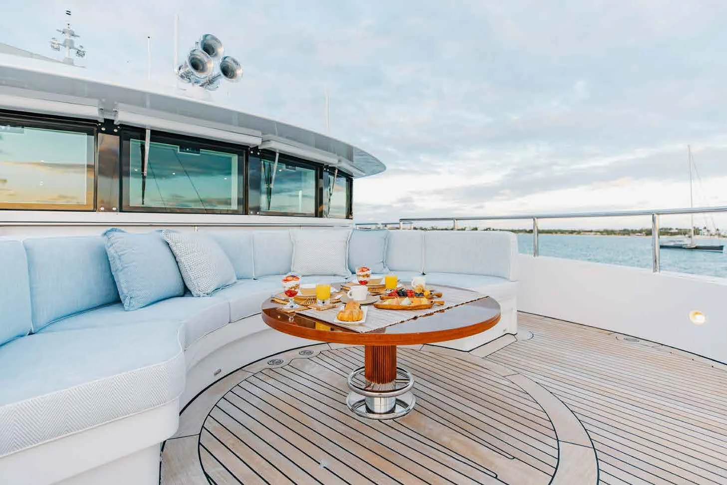 a living room with a couch and a table aboard LADY B Yacht for Charter