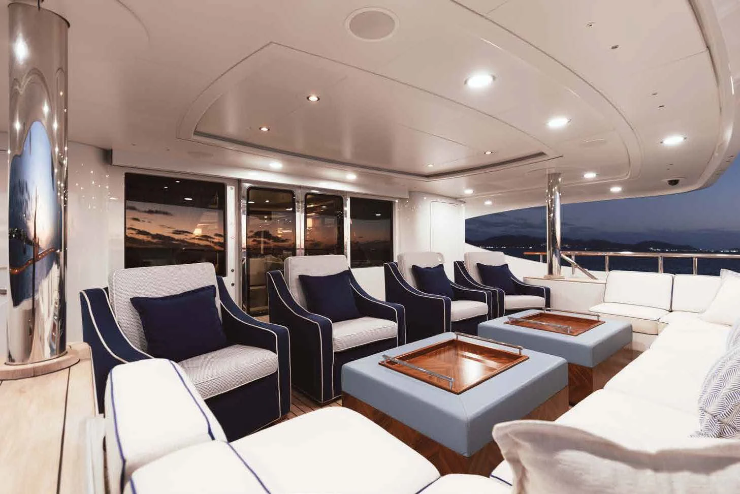 a room with chairs and tables aboard LADY B Yacht for Charter