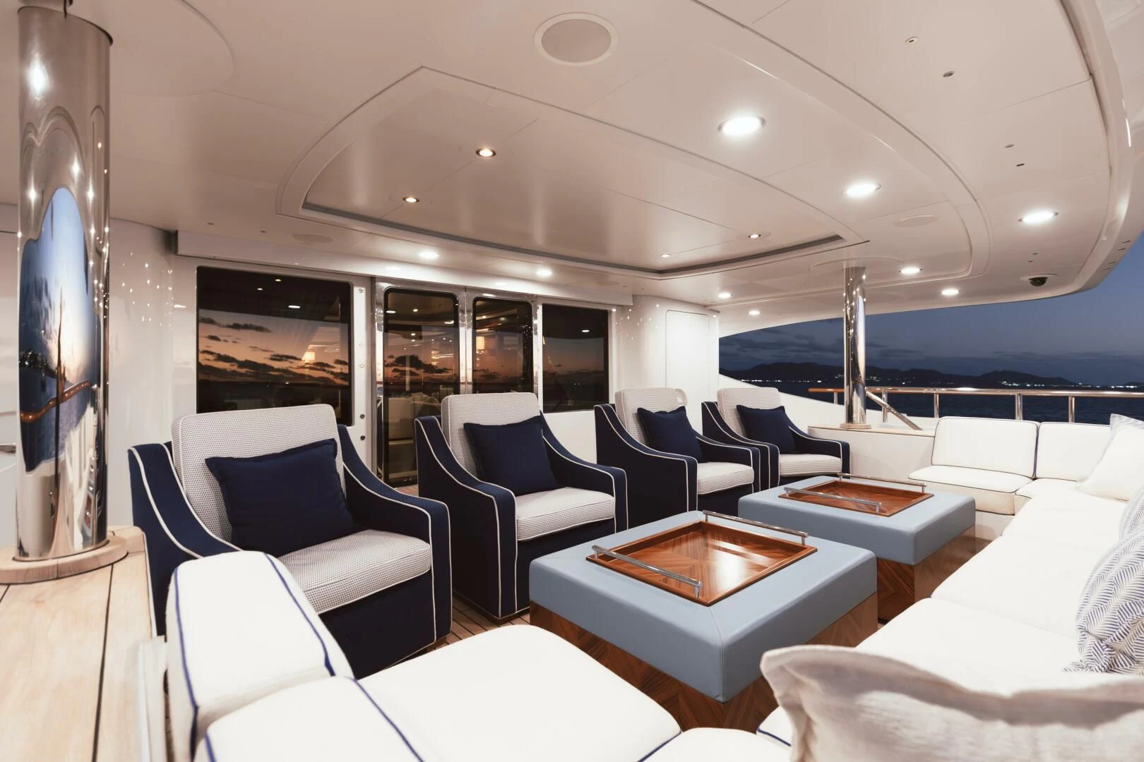a room with chairs and tables aboard LADY B Yacht for Charter