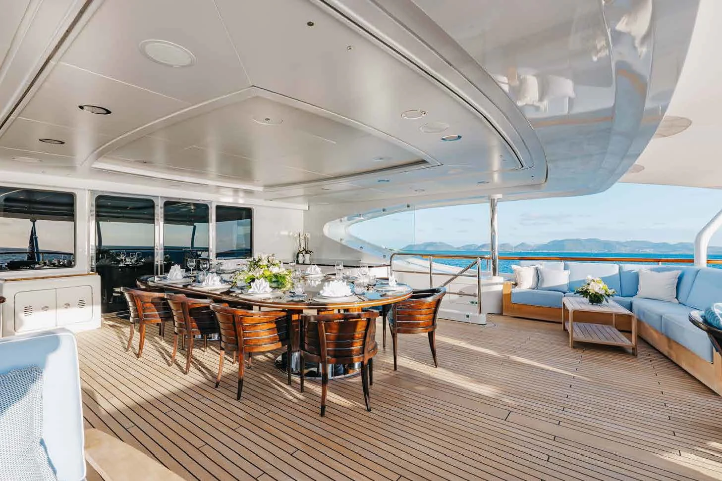 a room with a table and chairs aboard LADY B Yacht for Charter