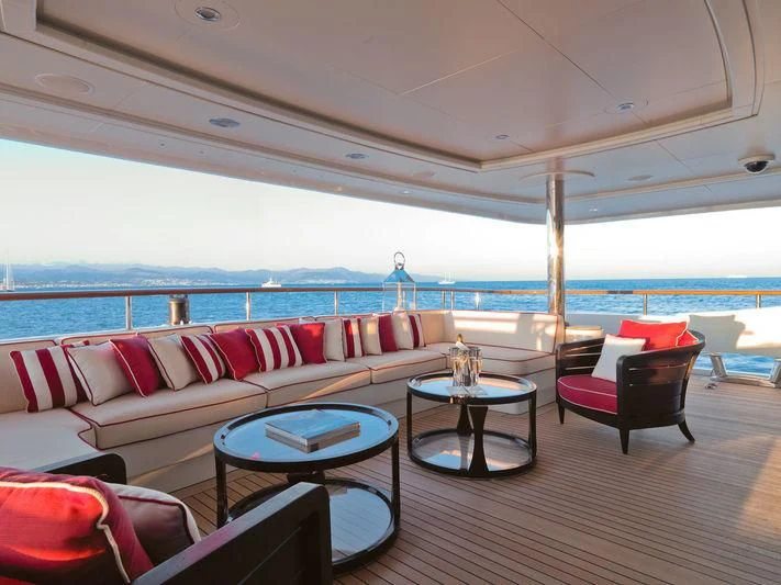 a living room with a large balcony aboard LADY B Yacht for Charter