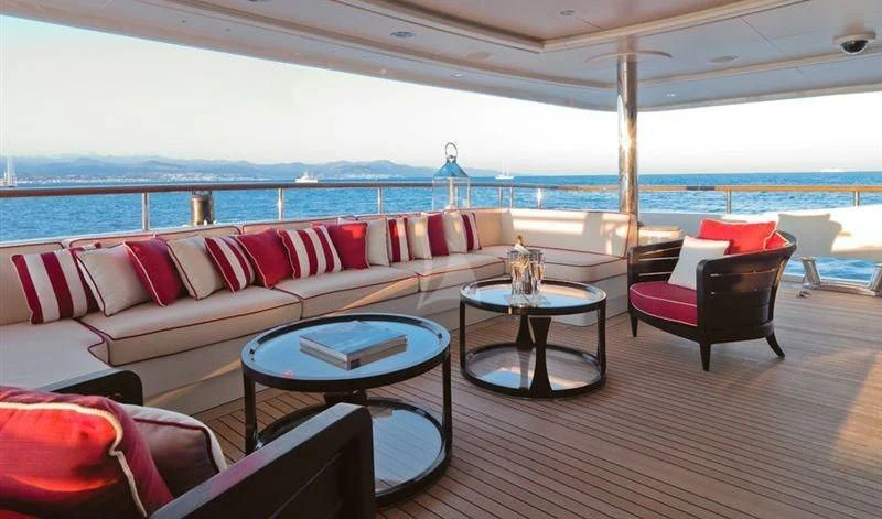 a living room with a large balcony aboard LADY B Yacht for Charter