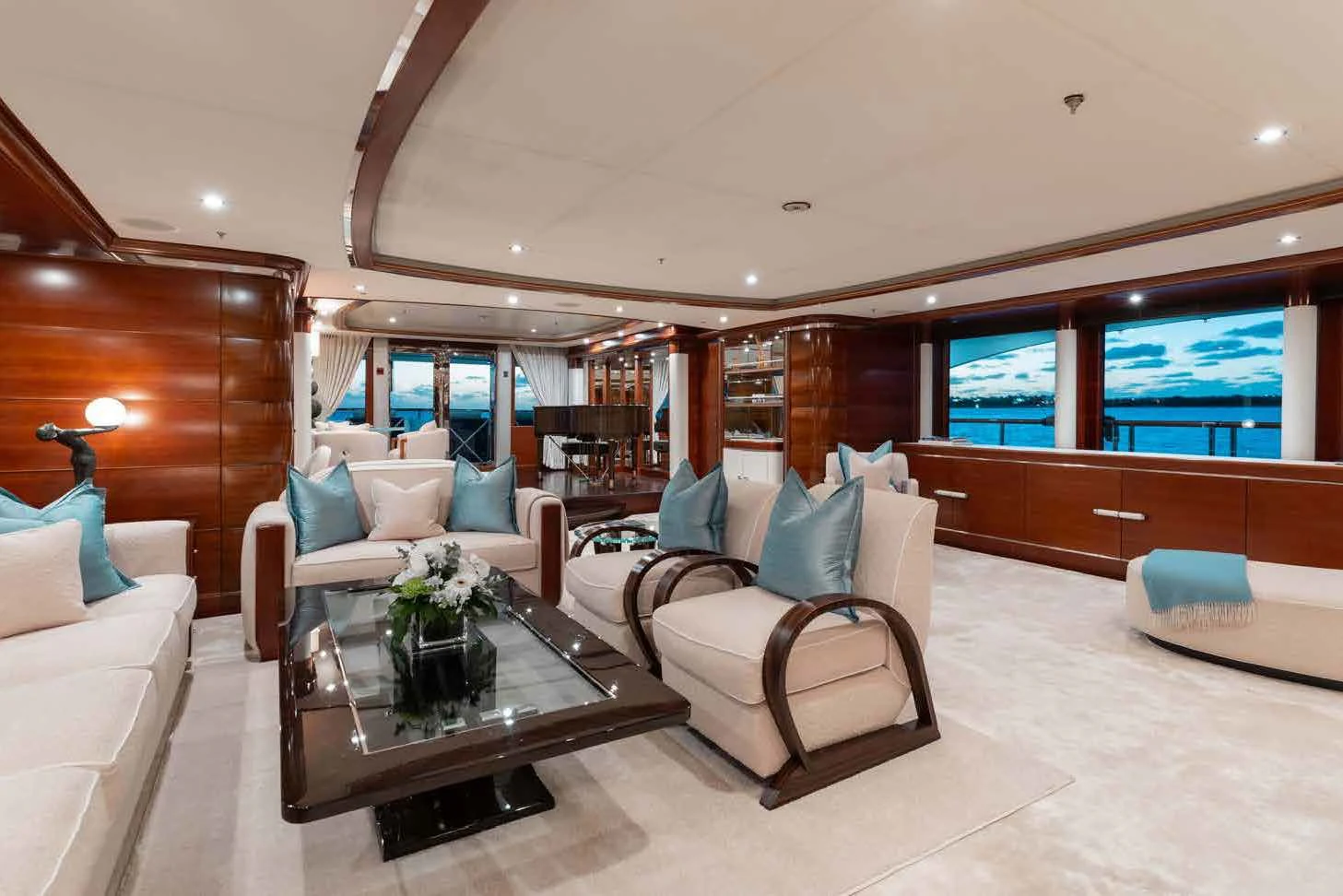a living room with a couch and a coffee table aboard LADY B Yacht for Charter
