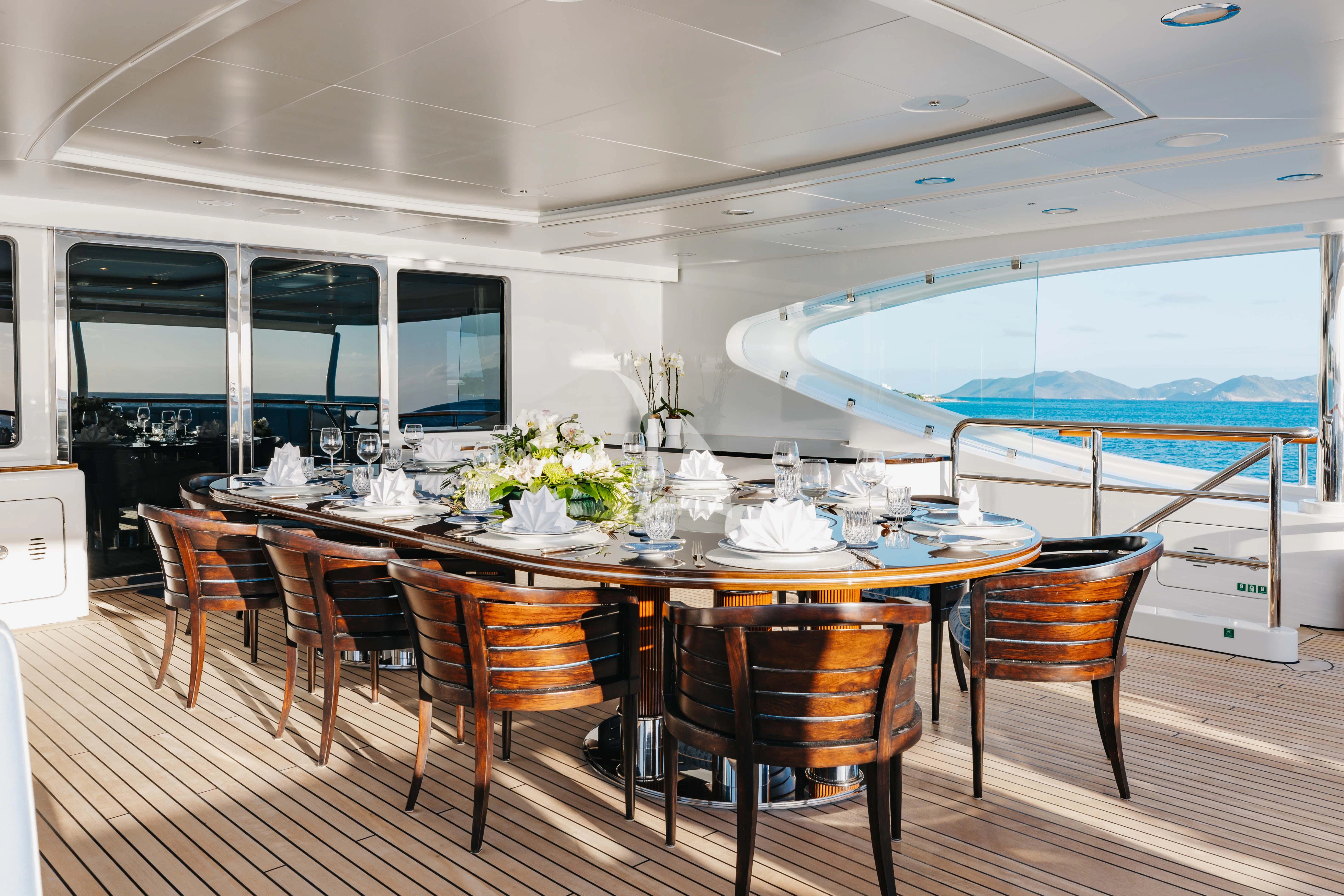 a dining table on a deck aboard LADY B Yacht for Charter