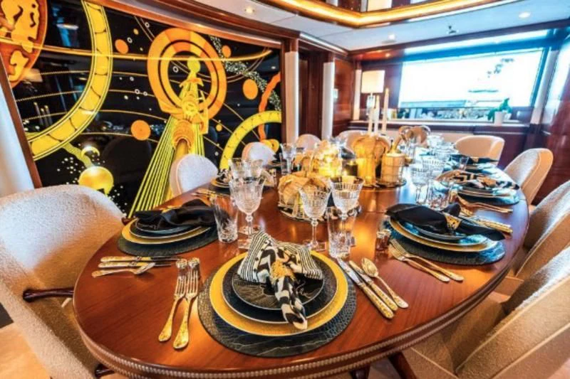 a table with a plate and glasses aboard LADY B Yacht for Charter