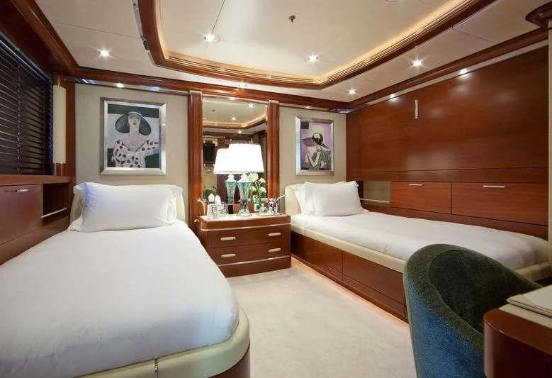 a room with a bed and a mirror aboard LADY B Yacht for Charter